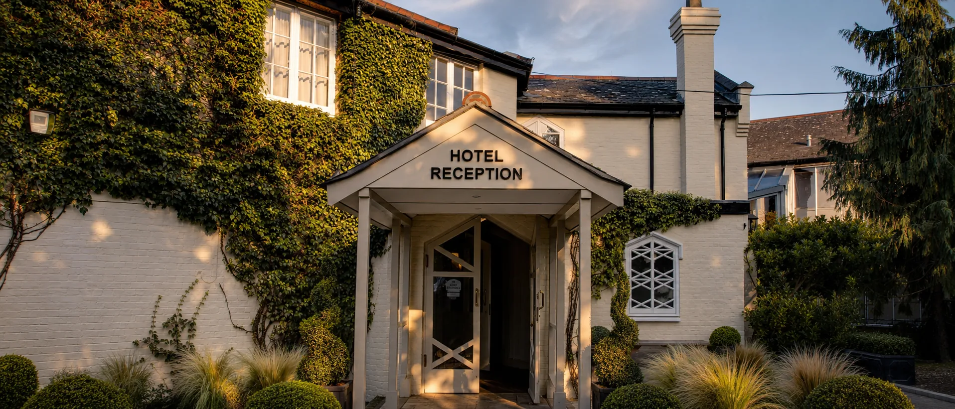 The ivy-covered hotel reception at golden hour